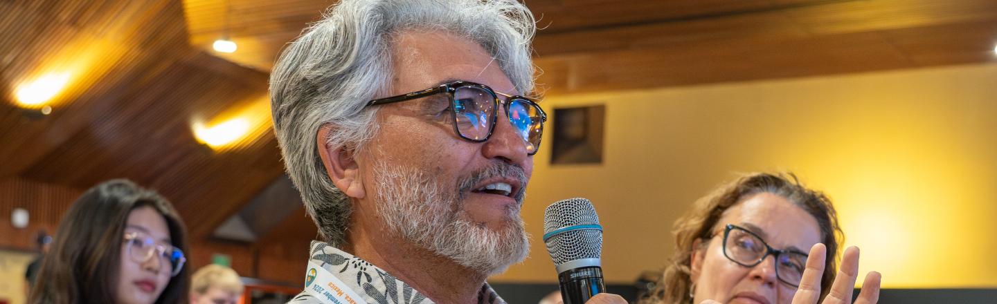 Man speaking from the audience at the Open Science Meeting