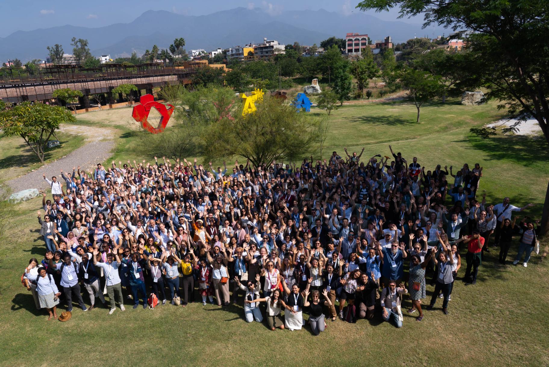 A large group of people standing in a field